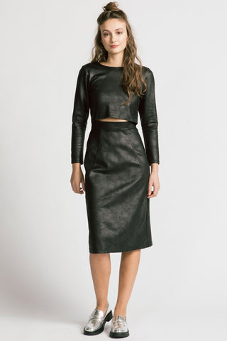 Model wearing black faux leatherette long sleeve Expectations dress by Allison Wonderland. 