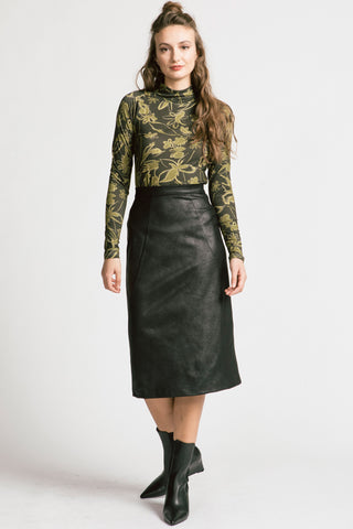 Model wearing olive floral turtleneck and black faux leatherette Graduate skirt by Allison Wonderland. 