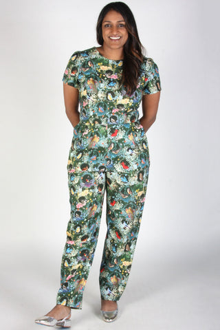 Model wearing bird print short sleeve fitted Auk jumpsuit by Birds of North America. 