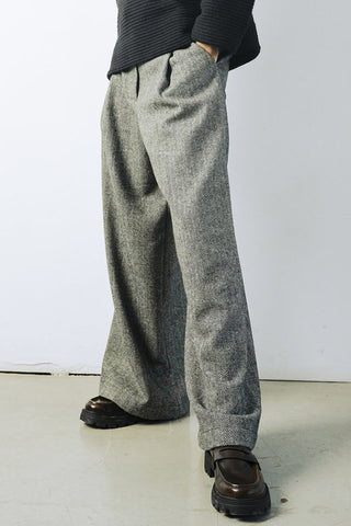 Model wearing wide leg wool blend herringbone Lewis pants by Bodybag. 