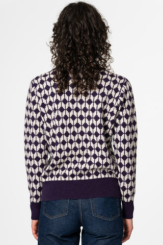 Back view of woman wearing purple merino wool Dhaka sweater by Dinadi. 