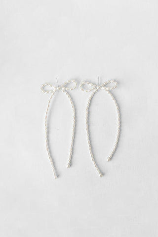 Rice pearl and sterling silver Maya bow earrings by Kara Yoo. 