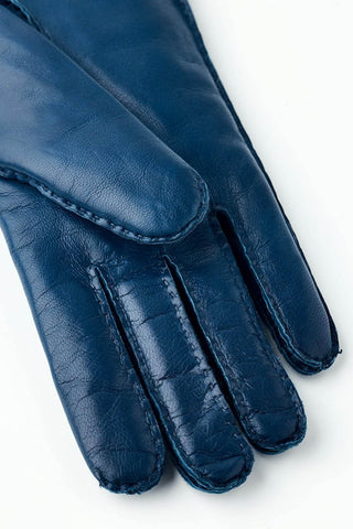 Close-up of midnight blue Mary leather gloves by Hestra. 