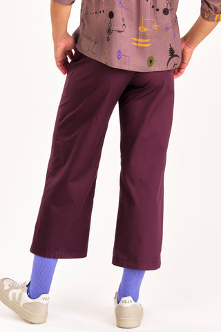 Back view of purple organic cotton cropped Elliot Pants by Jennifer Glasgow. 