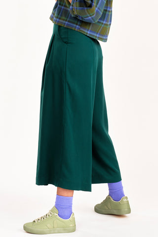 Side view of cropped green wide leg Harlow pants by Jennifer Glasgow. 