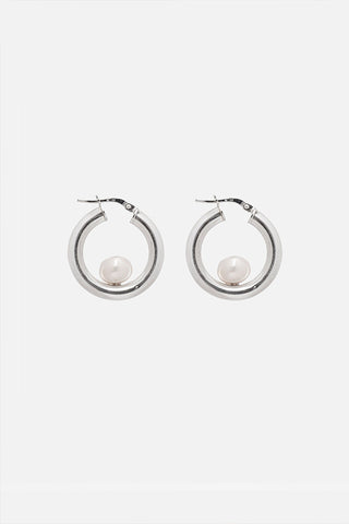 Sterling silver and pearl Luna Hoops by Kara Yoo. 