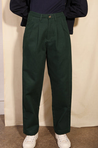 Model wearing forest green relaxed fit Classic Slacks by LF Markey. 