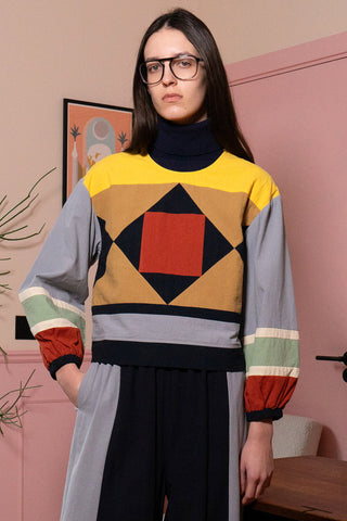 Woman wearing colourful colour blocked Sloane Top by LF Markey. 