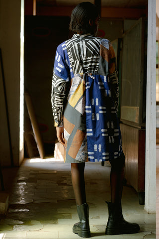 Back view of model wearing Press dress by Osei Duro in multi colour Virtual Reality print. 