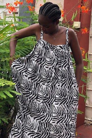 Model wearing black and white Long Division batik print Saya sundress by Osei Duro. 