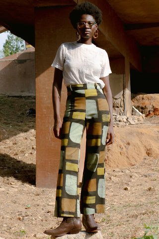 Model wearing Veronica pants in pistachio print by Osei Duro. 