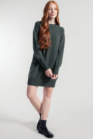 Model wearing forest green recycled wool Selvaggia Sweater dress by Rifo. 