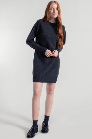 Model wearing carbon grey recycled wool Selvaggia Sweater dress by Rifo. 