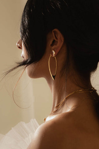 Model wearing gold Ariam Hoops by Sarah Mulder. 