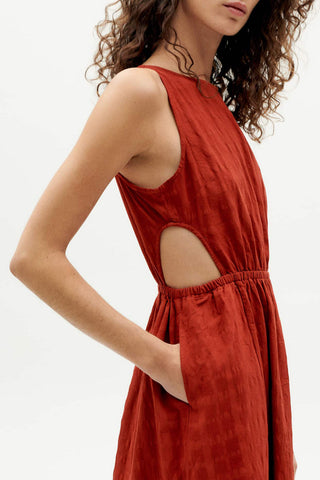 Close-up of cutout on organic red orange Kin dress by Thinking Mu. 