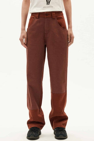 Model wearing brown hemp & organic cotton Perle pants by Thinking Mu. 