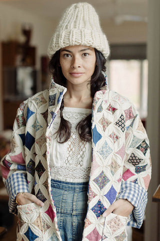 Modal wearing ivory chunky knit thick rib merino wool toque by Toast & Yarn. 