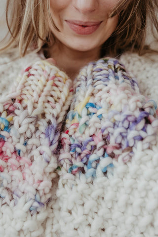 Close-up of chunky knit ivory merino wool ribbed knit Sprinkle Sweater by Toast & Yarn. 