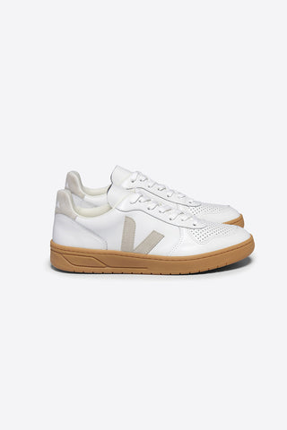 Side view of Veja V-10 sneakers in white ChromeFree leather with Natural suede logo and sole. 