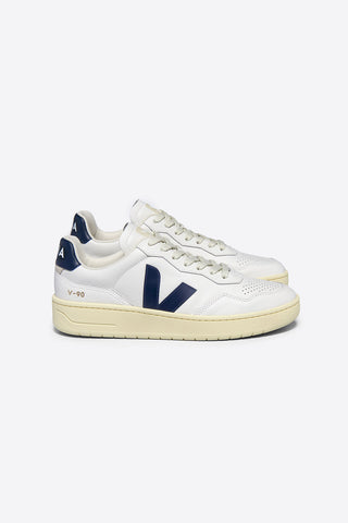 Side view of Veja V90 sneakers in extra white leather with dark navy logo. 