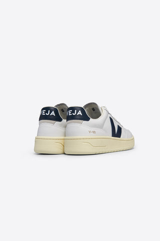 Back view of Veja V90 sneakers in extra white leather with dark navy logo. 