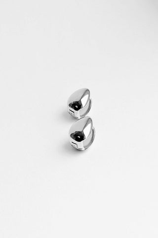 Kara Yoo Almond Huggie Hoops in sterling silver. 