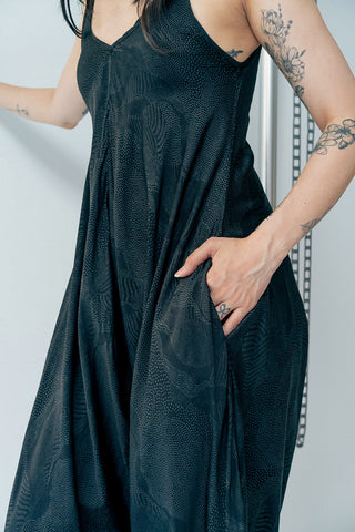 Close-up of hand printed black cupro Harem Jumpsuit by Rujuta Sheth. 